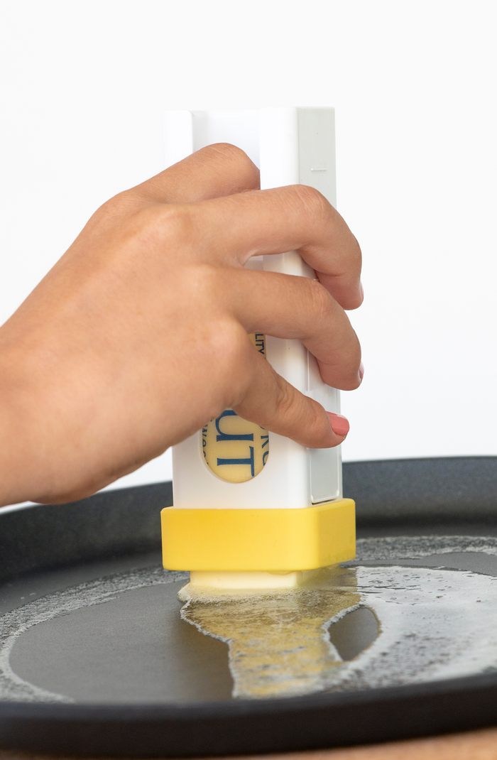 Buttering a hot crepe pan with The ButterBox™