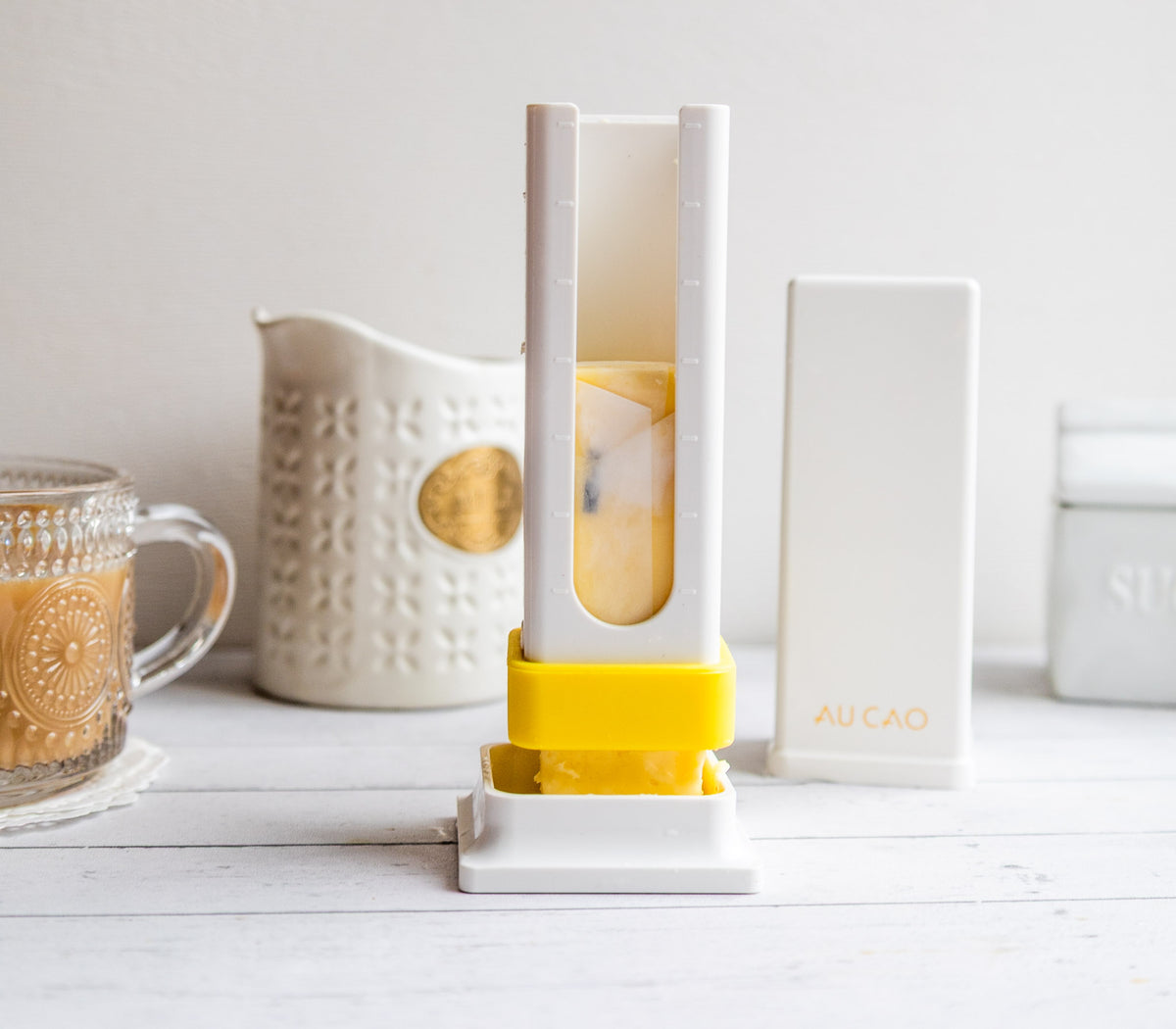 The ButterBox™ loaded with a butter stick, ready to grease pans for holiday baking