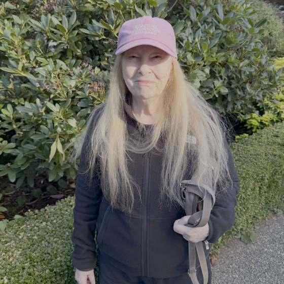 A Beautiful Downtown Burbank fan in Vancouver wearing a pink BDB cap